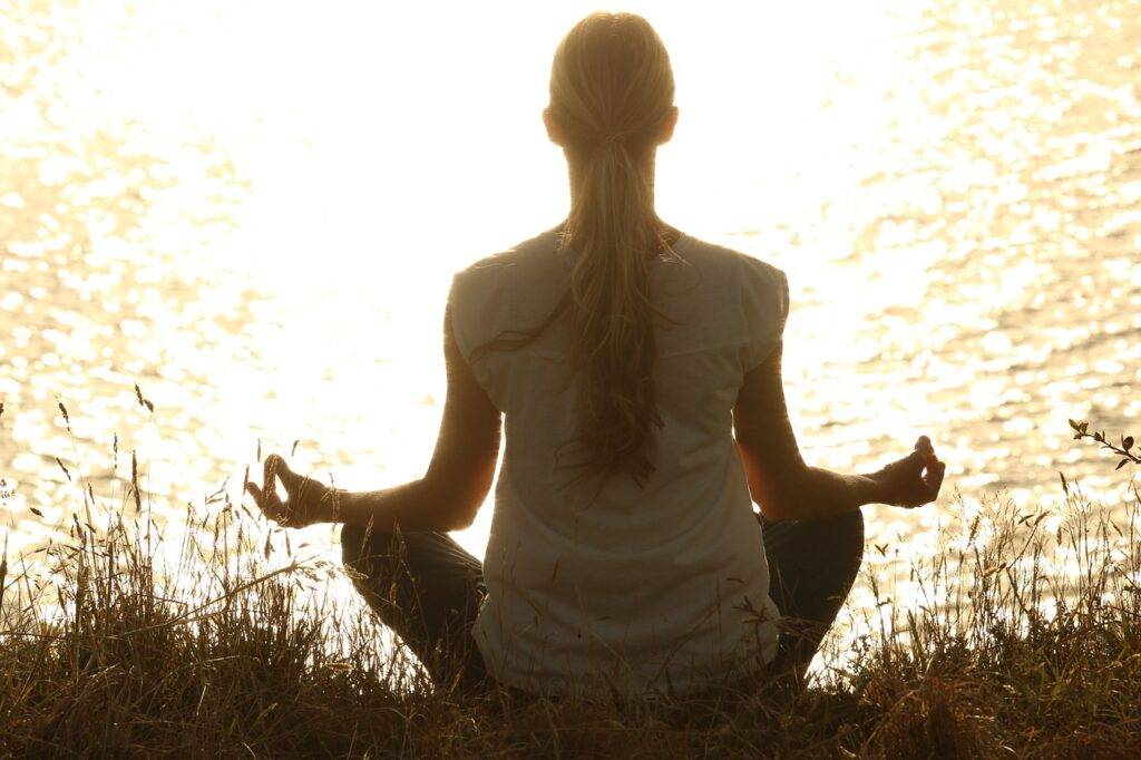 Healing Meditation: woman-meditating-at-lake