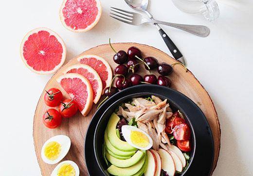 Plate with fruit, vegetables and several healthy oils foods inflammatory markers